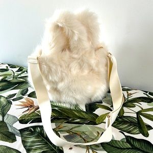 FAUX FUR Bag with convenient detachable body strap.